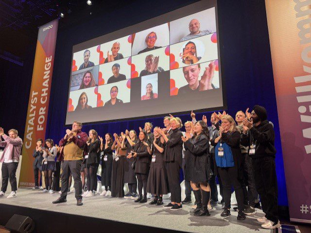 Group of speakers on stage at SDGC23 event