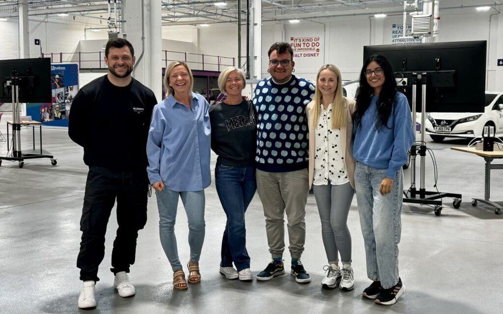 The SDA team posing for the camera in a warehouse at MSIP Skills Academy.